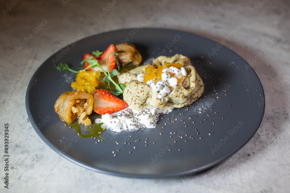 creative serving of pancakes in a restaurant with cottage cheese strawberries and fruit creative serving of pancakes in a restaurant with cottage cheese strawberries and fruit