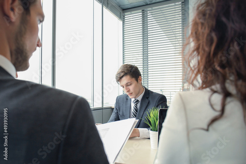 Job interview with the employer, businessman listen to candidate answers photo
