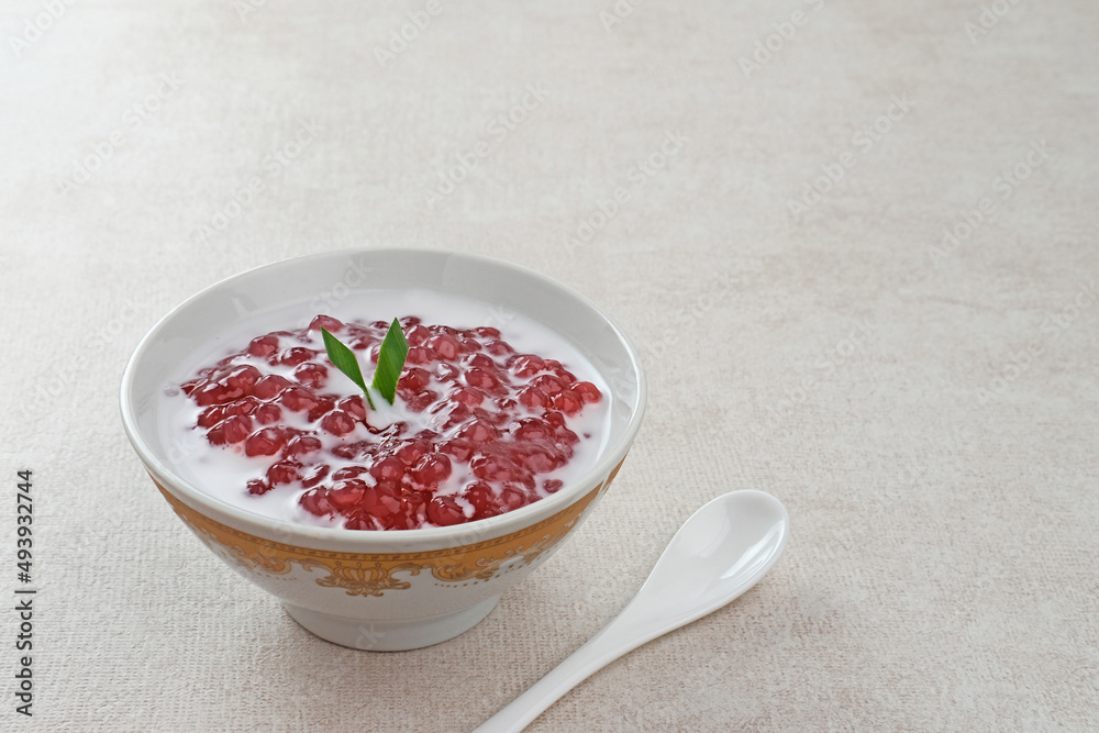 Bubur Mutiara, Bubur Sagu Mutiara, Indonesian Dessert Porridge. Made from pearl sago (sagu mutiara), sugar, pandan leaves, and coconut milk. Very famous during Ramadhan. Selective focus image.
Bubur Mutiara, Bubur Sagu Mutiara, Indonesian Dessert Porridge. Made from pearl sago (sagu mutiara), sugar, pandan leaves, and coconut milk. Very famous during Ramadhan. Selective focus image.