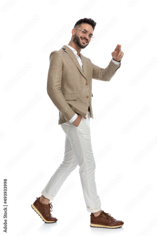 businessman walking one way and pointing at the camera businessman walking one way and pointing at the camera
