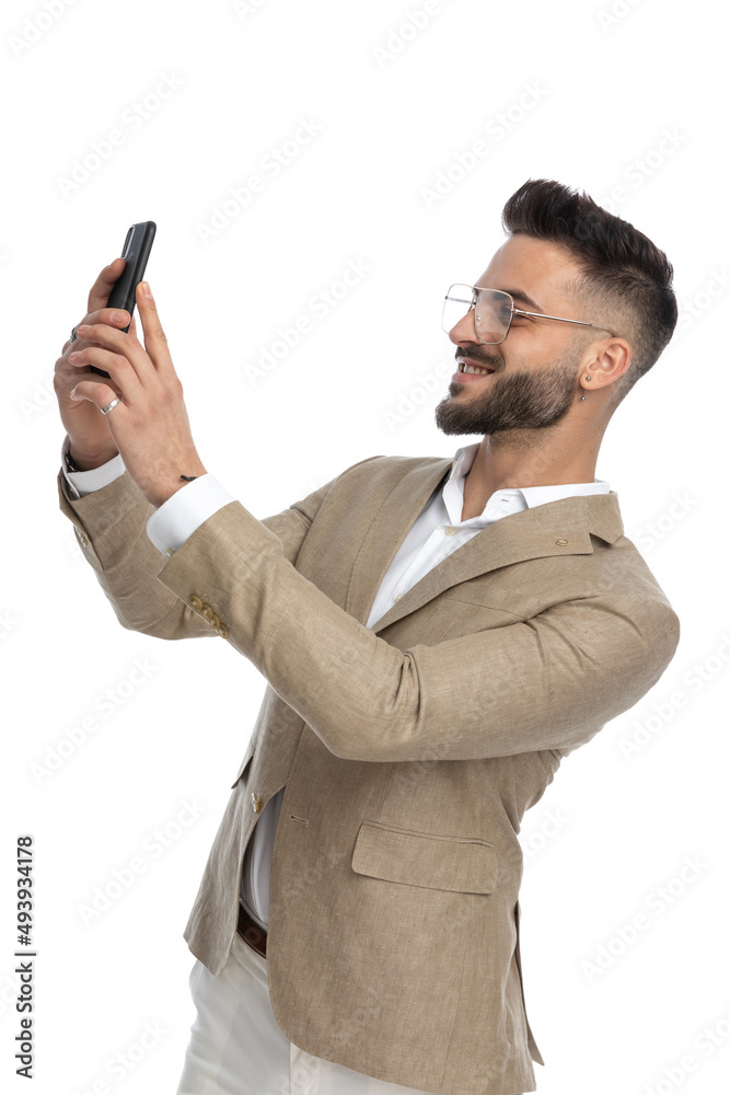 handsome businessman taking a selfie and smiling at the camera handsome businessman taking a selfie and smiling at the camera