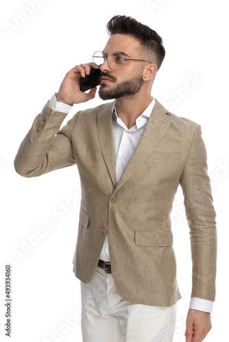 handsome businessman having a conversation at the phone