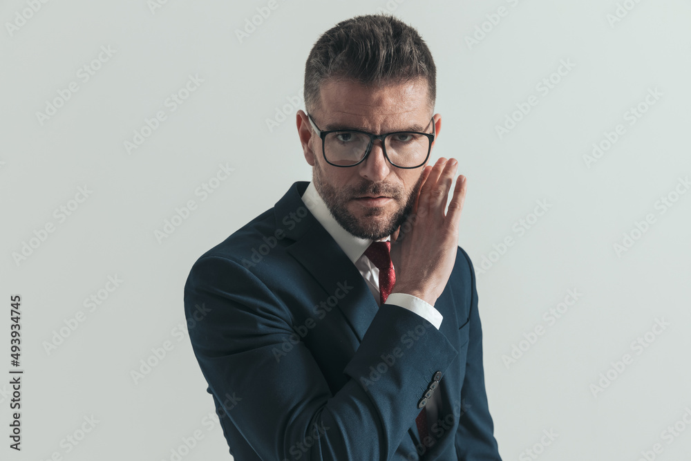 serious man with beard and glasses covering face and gossiping serious man with beard and glasses covering face and gossiping