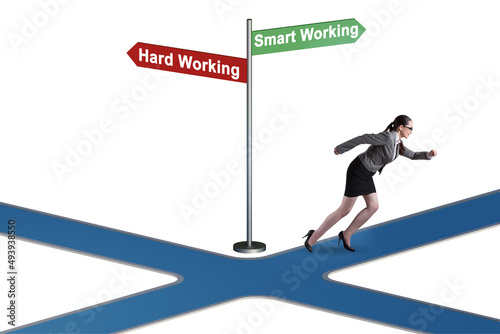 Businesswoman at the crossroads on working smart or hard