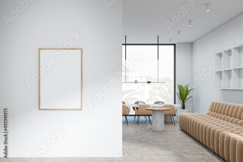 Bright living room interior with empty white poster  panoramic window