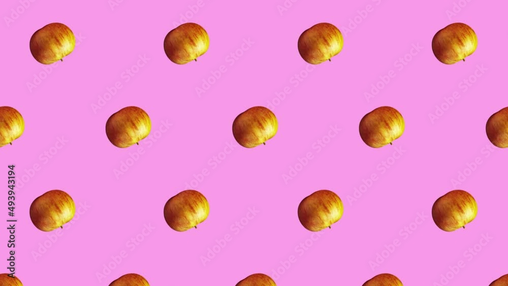 Minimal motion design - red apples rotating and moving down at pink color background. Trendy colors and style graphics. Seamless looping animation. Minimal motion design - red apples rotating and moving down at pink color background. Trendy colors and style graphics. Seamless looping animation.