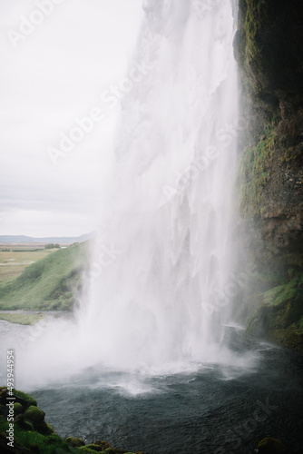 Seljalandsfoss stream of water dropping down into it s own pool. Iceland  waterfall