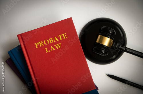 Top view of probate law book with gavel on white background. photo