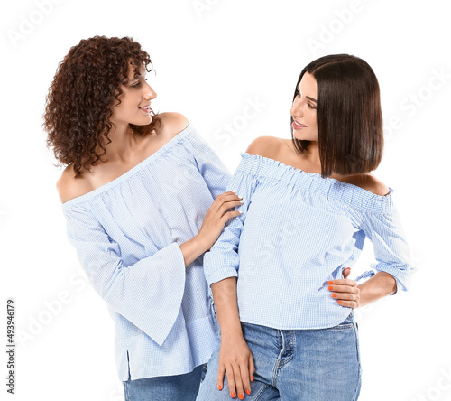 Young sisters looking at ea...