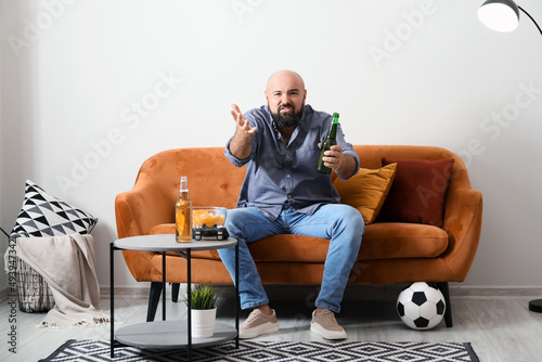 Funny lazy man drinking bee...