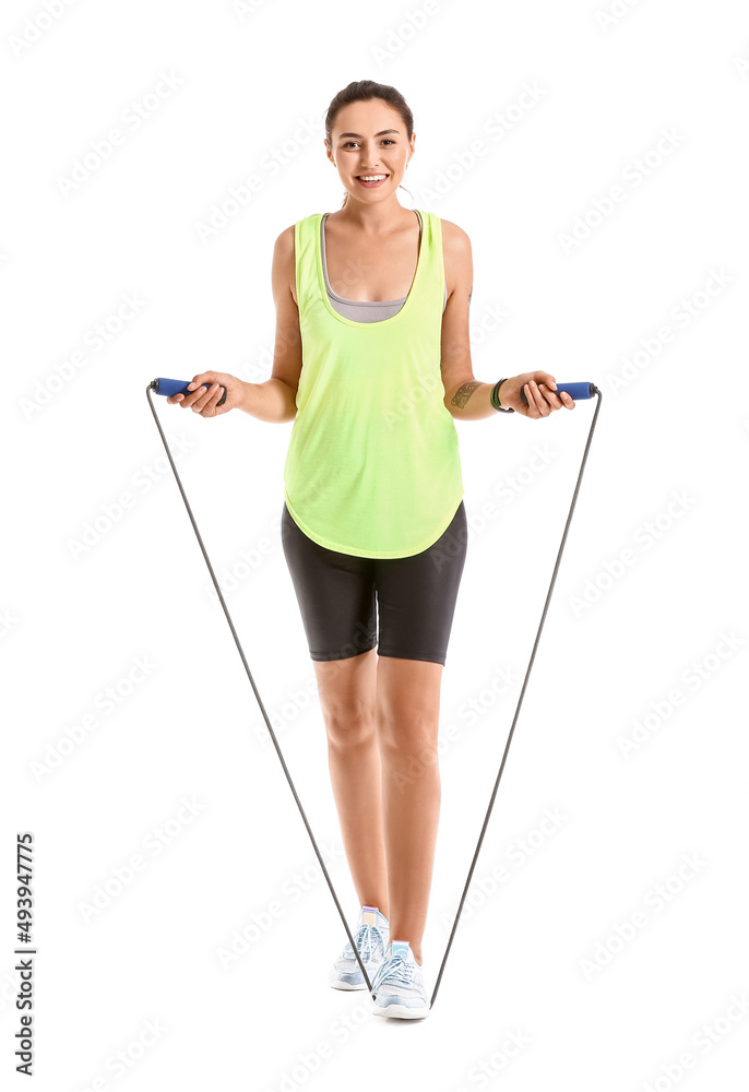 Sporty young woman with skipping rope on white background Sporty young woman with skipping rope on white background