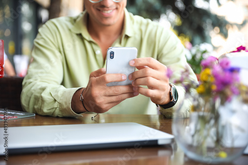 Handsome man using mobile p...