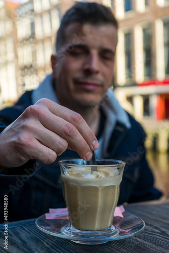 Man drinking coffee on a terrace. Spring time