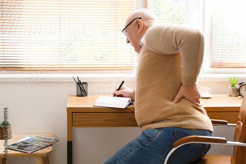 Senior man with back pain w...