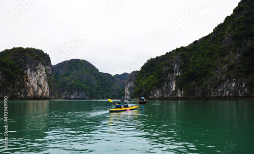 Tourists kayaking in emerald Lan Ha bay, Ha Long, Vietnam © hippomyta