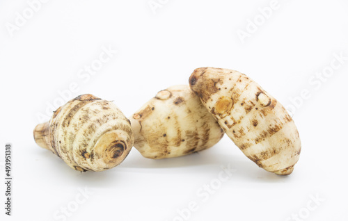 fresh taro root also known as Arbi on white background,