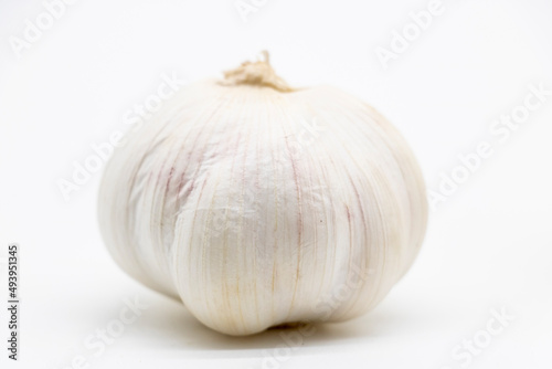 Isolated garlic.. Fresh peeled garlic cloves, bulb with garlic slices isolated on white background.