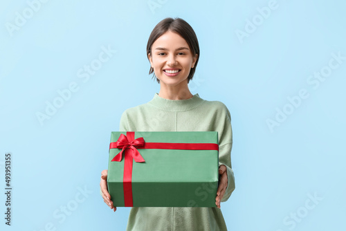 Beautiful woman holding gif...