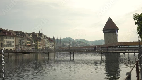 People walking on Chapel bridge at Lucerne, Switzerland. Zoom in photo