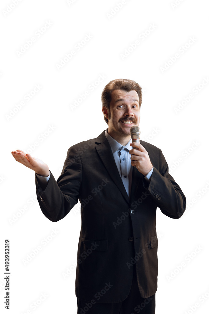 Emotive young man, professional sport commentator, journalist with microphone broadcasting football match isolated over white background. Sport, news concept Emotive young man, professional sport commentator, journalist with microphone broadcasting football match isolated over white background. Sport, news concept