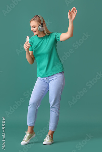 Woman listening to music an...
