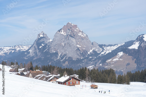 Fototapeta Naklejka Na Ścianę i Meble -  Flumserberg, Skiers, snowboarders, carvers, families all enjoy their time on the ski runs of winter sports resort located directly above Lake Walen. 65 km of perfectly groomed slopes invite you.