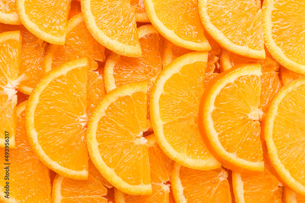 Many ripe orange slices as background, closeup Many ripe orange slices as background, closeup