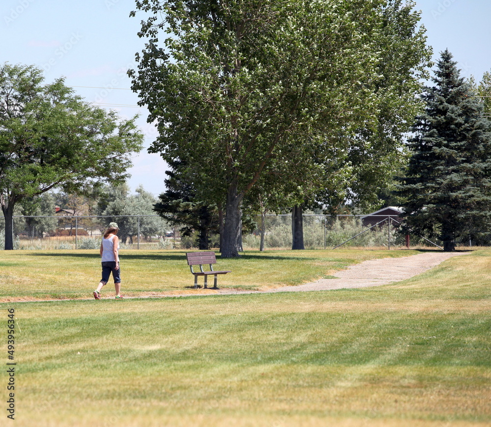 Mature female senior on walking trail outdoors. Mature female senior on walking trail outdoors.