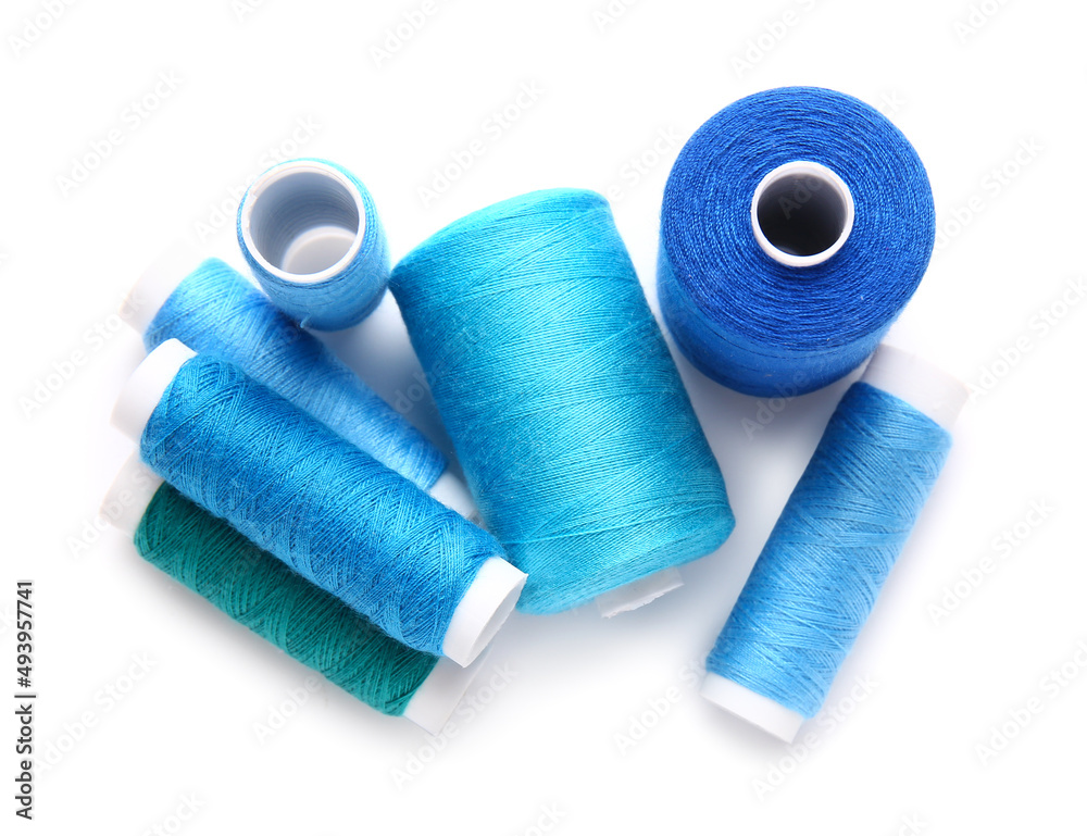 Different thread spools on white background Different thread spools on white background