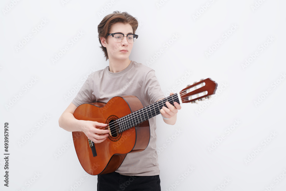 boy playing the guitar boy playing the guitar