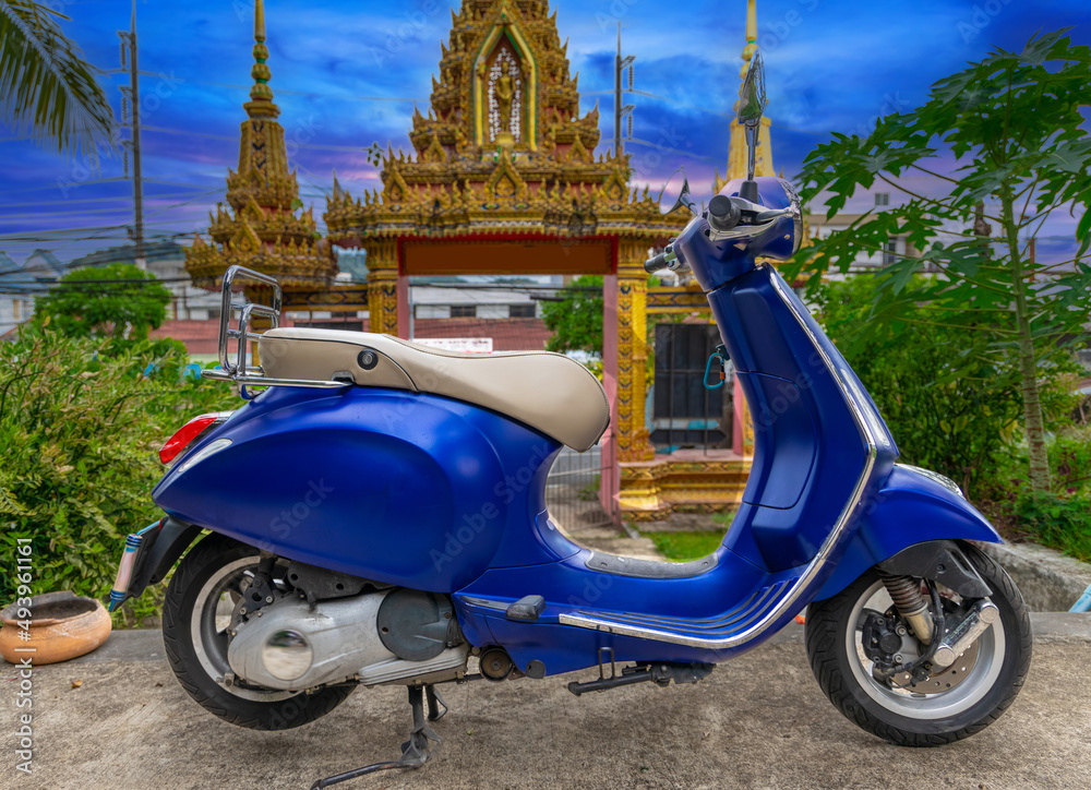 Blue Motor bike at temple in Phuket town thailand. 