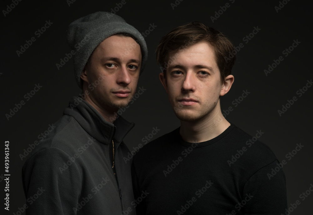 portrait of two Ukrainian twin brothers with confident emotions