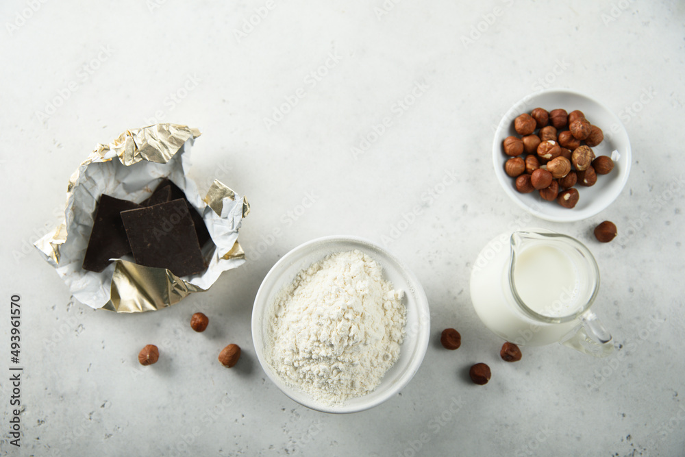 Baking ingredients on a white table Baking ingredients on a white table