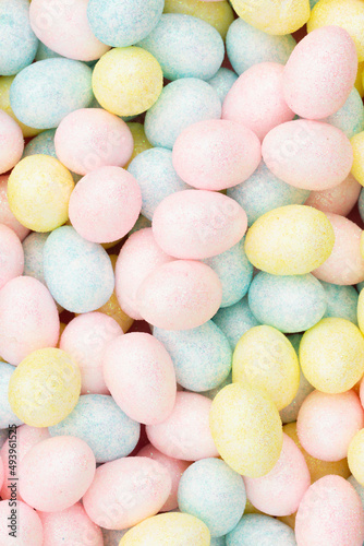 Colorful pastel Easter eggs candy background