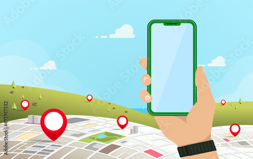 Hand holding mobile phone with gps navigation showing in the city and outlying districts