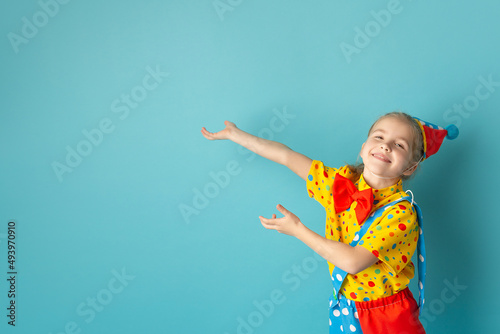 Fototapeta Funny kid clown against blue background