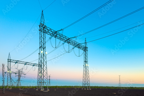 Electric substation and pwer lines in Paraguay at dawn.