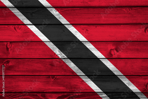 Flag of Trinidad and Tobago on wooden surface  photo