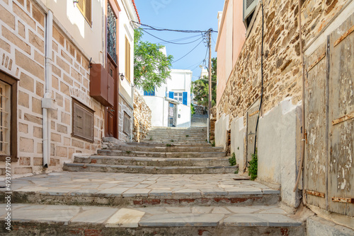 Neoclassical building and empty paved street and stair, Syros island, Ermoupolis Cyclades, Greece photo