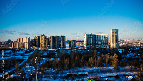 panoramic photo of a residential complex from a height against a blue sky 