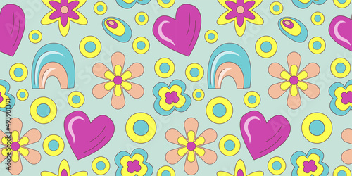 Groovy pattern in doodle style on colorful background. 70s retro floral seamless pattern with heart and rainbow. Simple vector groovy illustration.