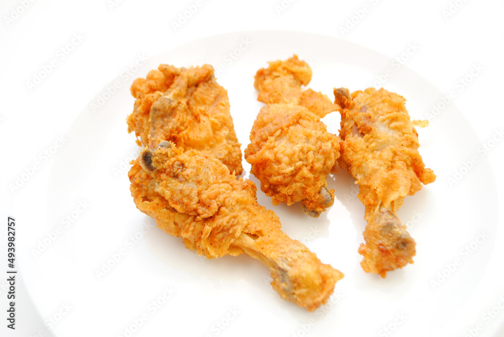 Hot and Spicy Chicken Pieces on a White Plate Hot and Spicy Chicken Pieces on a White Plate