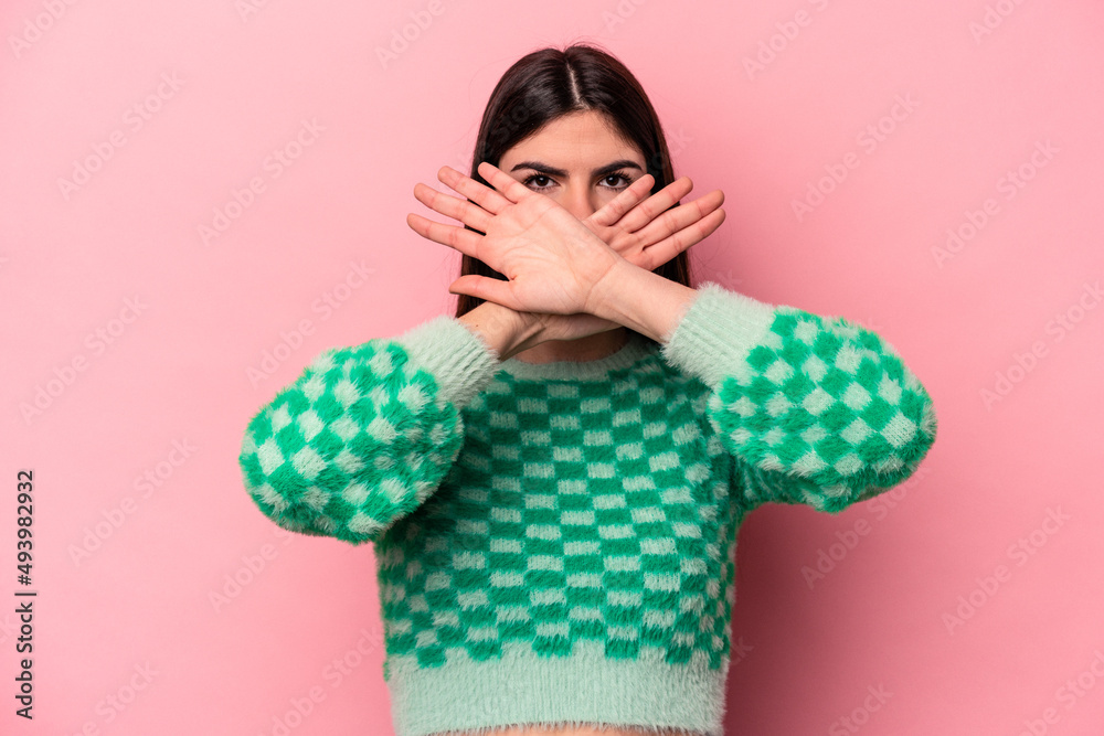 Young caucasian woman isolated on pink background doing a denial gesture Young caucasian woman isolated on pink background doing a denial gesture