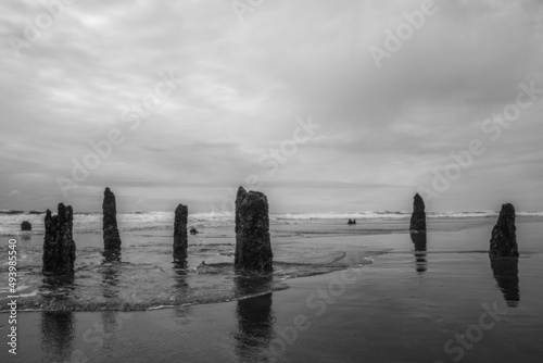 Photo of rocks standing on ocean pier photo