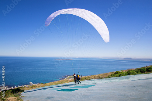 Paragliding in Cape Town, South Africa. Sunny day. Adventure sport.