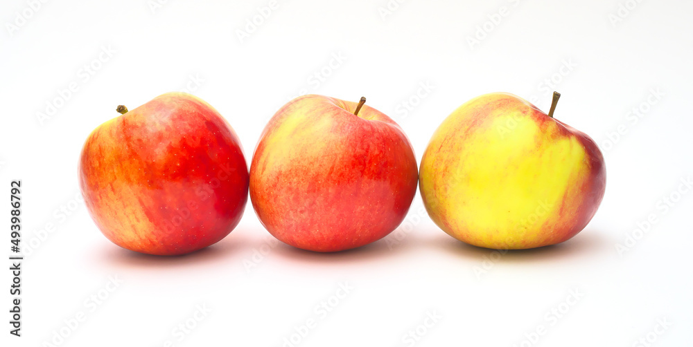Three apples on an isolated white background. Panoramic photography. Three apples on an isolated white background. Panoramic photography.