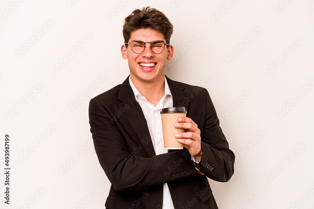 Young caucasian business man holding takeaway coffee isolated on white background laughing and having fun. Young caucasian business man holding takeaway coffee isolated on white background laughing and having fun.