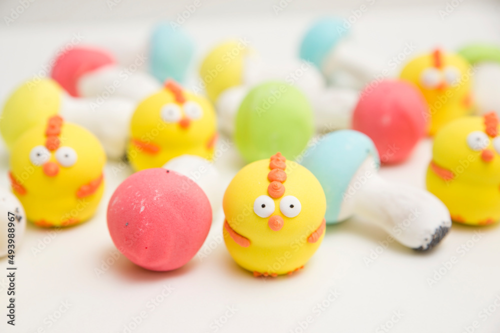 Gingerbread mushrooms Fly agaric. Easter theme. Colored biscuits on white background. Gingerbread mushrooms Fly agaric. Easter theme. Colored biscuits on white background.