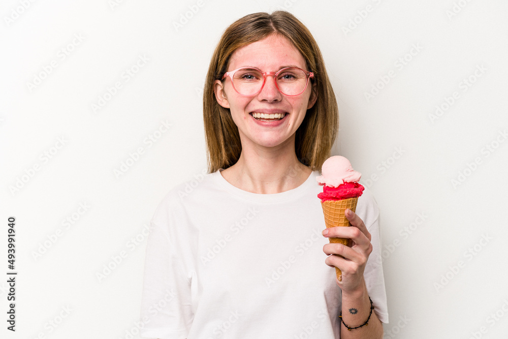 Young English woman holding an ice cream isolated on white background happy, smiling and cheerful.