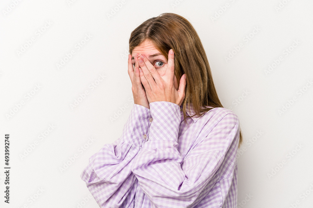 Young russian woman isolated on white background blink through fingers frightened and nervous. Young russian woman isolated on white background blink through fingers frightened and nervous.